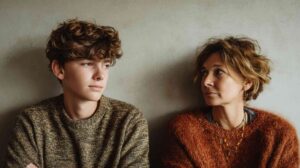 Does my teen need therapy — parent and teenage son sitting together during a quiet, thoughtful moment at home