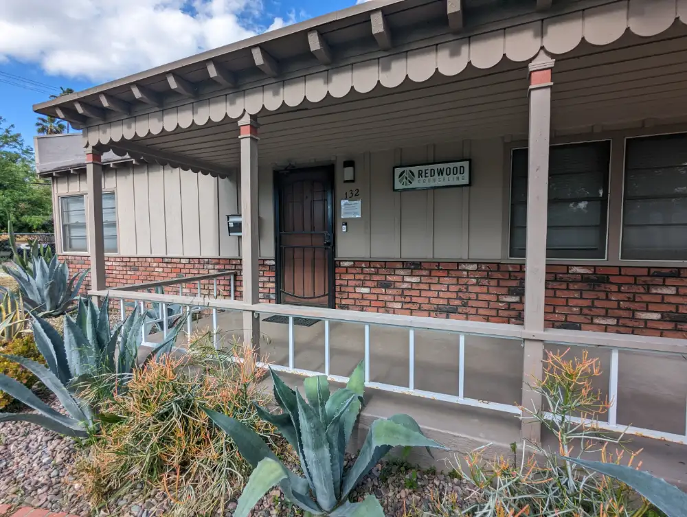 Front entrance of Redwood Counseling’s Hemet office, with a covered porch, ramp, and Redwood Counseling sign.