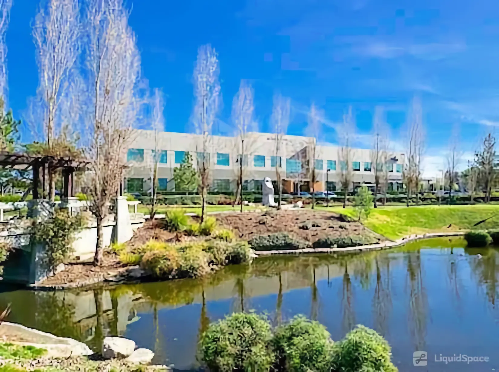 Office building housing Redwood Counseling’s Riverside location, overlooking a landscaped pond.